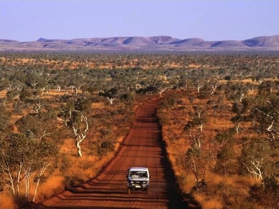 Car on Outback Road, Karijini National Park, Australia Car on Outback Road, Karijini National Park, Australia