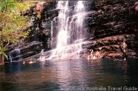 The Australian Outback is not all desert. Swimming at a tropical waterfall The Australian Outback is not all desert. Swimming at a tropical waterfall