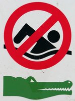 A sign, warning that the water here is infested with Australian crocodiles.