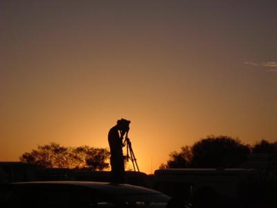 Man on Roof of Car